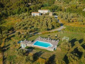 an aerial view of a house with a swimming pool at Appartamenti Borgo San Pietro in Deiva Marina