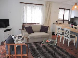 a living room with a couch and a table at Casa Hella by fewotessin in Lavertezzo