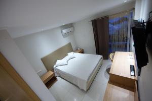 מיטה או מיטות בחדר ב-Thomas Beach Hotel