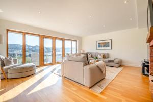 a living room with a couch and a table at 4 Bed in Newquay oc-b27906 in Newquay