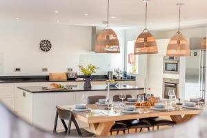 a kitchen with a table and chairs in a kitchen at 4 Bed in Newquay oc-b27906 in Newquay