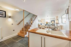 a kitchen with a sink and a staircase at 2 Bed in Croyde oc-r27591 in Croyde