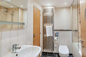 a bathroom with a sink and a toilet at 2 Bed in Croyde oc-r27591 in Croyde +20 photos