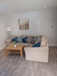 a living room with a couch and a coffee table at 103 Whalley Road Ramsbottom in Ramsbottom