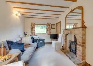 a living room with a couch and a fireplace at 3 Bed in Crayke oc-y056 in Crayke