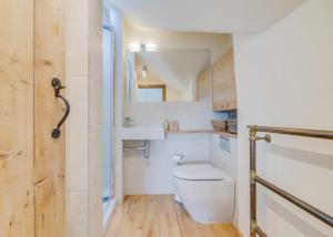 a small bathroom with a toilet and a sink at 3 Bed in Crayke oc-y056 in Crayke +27 photos