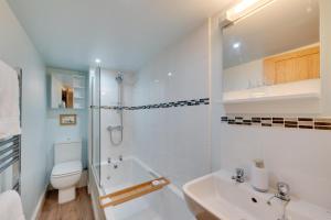 a white bathroom with a toilet and a sink at 5 Bed in Muker oc-ds1056 in Muker +38 photos