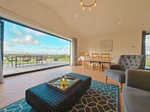 a living room with a large sliding glass door at 2 Bed in Stanton oc-p30248 in Ticknall