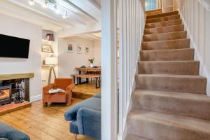 a staircase in a living room with a fireplace at 2 Bed in Mumbles oc-v30980 in The Mumbles
