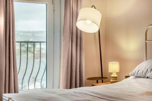 a bedroom with a bed and a large window at 2 Bed in Mumbles oc-v30980 in The Mumbles