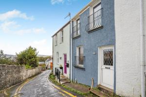 a blue and white house on a street at 2 Bed in Mumbles oc-v30980 in The Mumbles