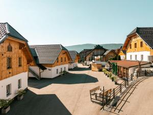 an aerial view of a village with wooden buildings at Feriendorf Edelweiss in Mariapfarr