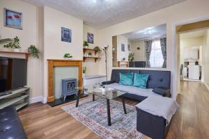a living room with a couch and a table at Host & Stay - Dover Retreat in Ipswich