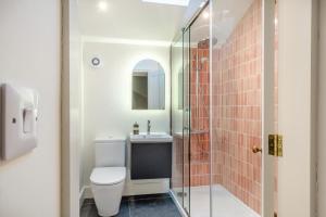 a bathroom with a toilet and a glass shower at 5 Bed in Ulpha oc-b32731 in Ulpha +24 photos