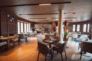 a restaurant with tables and chairs in a room at Nomada House by SH Hoteles in Denia