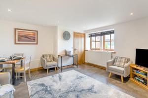a living room with a table and a dining room at 2 Bed in Hatton oc-t32765 in Peterhead