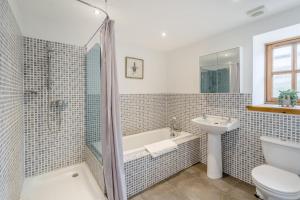 a bathroom with a tub and a sink and a toilet at 2 Bed in Hatton oc-t32765 in Peterhead +19 photos
