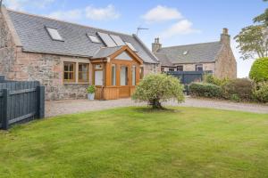 an exterior view of a house with a yard at 2 Bed in Hatton oc-t32765 in Peterhead