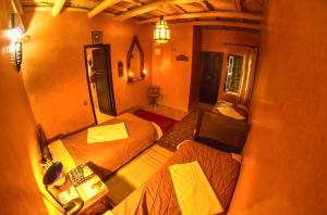 an overhead view of a bedroom with two beds at riad imlil in Imlil