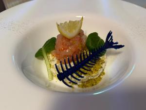 a plate of food on a white plate at BLUE Airuno in Airuno +17 photos