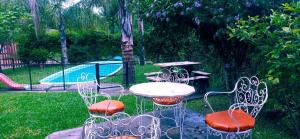 a patio with a table and chairs and a playground at Cabañas la calma in Concordia