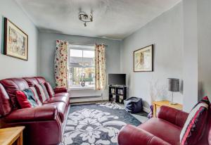 a living room with two couches and a window at 2 Bed in Skipton oc-ds221 in Skipton