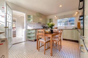 a kitchen with a wooden table and chairs in it at 2 Bed in Dennington oc-b28093 in Dennington +14 photos