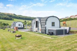 a group of three sheds in a field at 1 Bed in Cross oc-s29656 in Axbridge
