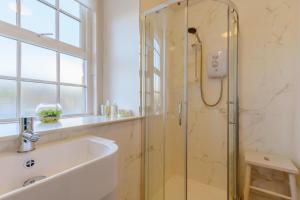 a bathroom with a shower and a tub and a sink at 3 Bed in Bainbridge oc-c28300 in Bainbridge +17 photos