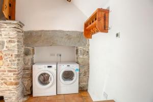 a laundry room with a washer and dryer at 2 Bed in Penmaenpool oc-p32333 in Penmaenpool