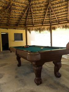 a pool table in a room with awning at Villa Clarice in Bonao
