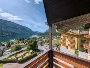 a balcony with a view of a lake at Hotel Excelsior in Molveno