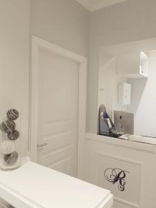 a bathroom with a sink and a mirror at Residenza Vatican Suite in Rome