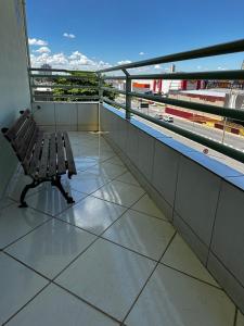 a bench sitting on top of a building at Hotel Realeza in Goiânia