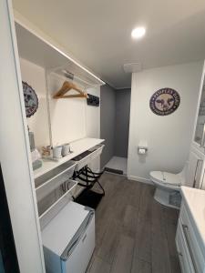 a bathroom with a sink and a toilet in it at Blue Cow Guest Farm in Cornville +39 photos