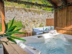 a hot tub in the middle of a patio at 2 Bed in Bakewell oc-90406 in Bakewell