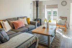 a living room with a couch and a wood stove at 2 Bed in St Helens oc-76608 in Brading +19 photos