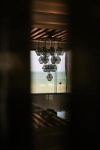 a view from a window of a room with a view of the ocean at Beach House Costa Yucatan by Trobbu Collection in Xtampú