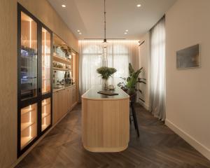 a kitchen with a island in the middle of a room at The Castelletto - Boutique Hotel in Montebelluna