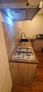 a kitchen counter with a stove top in a kitchen at Cabañas Bio Bio Osorno in Osorno