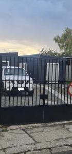 a bus parked behind a fence with a bus at Cabañas Bio Bio Osorno in Osorno