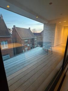 a view from a window of a balcony with a deck at The Corner-MARGO in Beernem