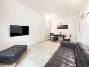 a living room with a couch and a table at Emmas FEWO in Bremen