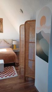 a bedroom with a bed and two wicker structures at Blick auf den Magdalenenberg in Villingen-Schwenningen