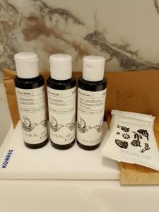 three bottles of ink sitting on top of a shelf at Lighthouse Hotel in Alexandroupoli