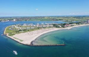 an aerial view of a beach with a resort at FW Knütel Nr 59 in Burgtiefe auf Fehmarn  +11 photos