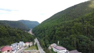 a town in the middle of a mountain at Hotel Eurosan in Slănic-Moldova