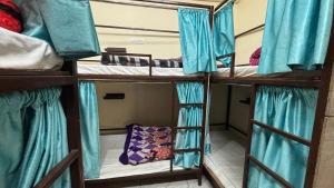 a group of four bunk beds in a room at Krishna Homestay in Bhowāli