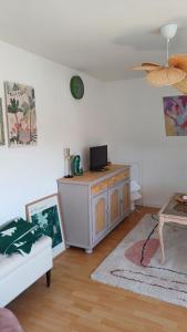 a living room with a couch and a table at Blick auf den Magdalenenberg in Villingen-Schwenningen