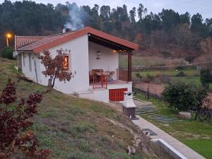a small white house on top of a hill at Quinta da Peça Douro Wine Region Retreat, Private Pool Villa in Vila Real